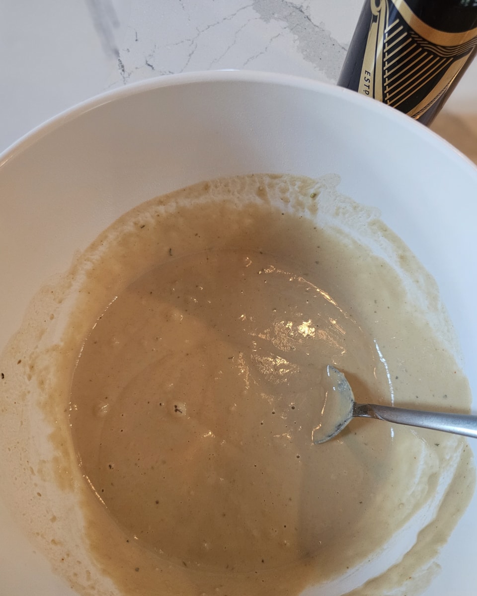 Guinness beer batter in a bowl.