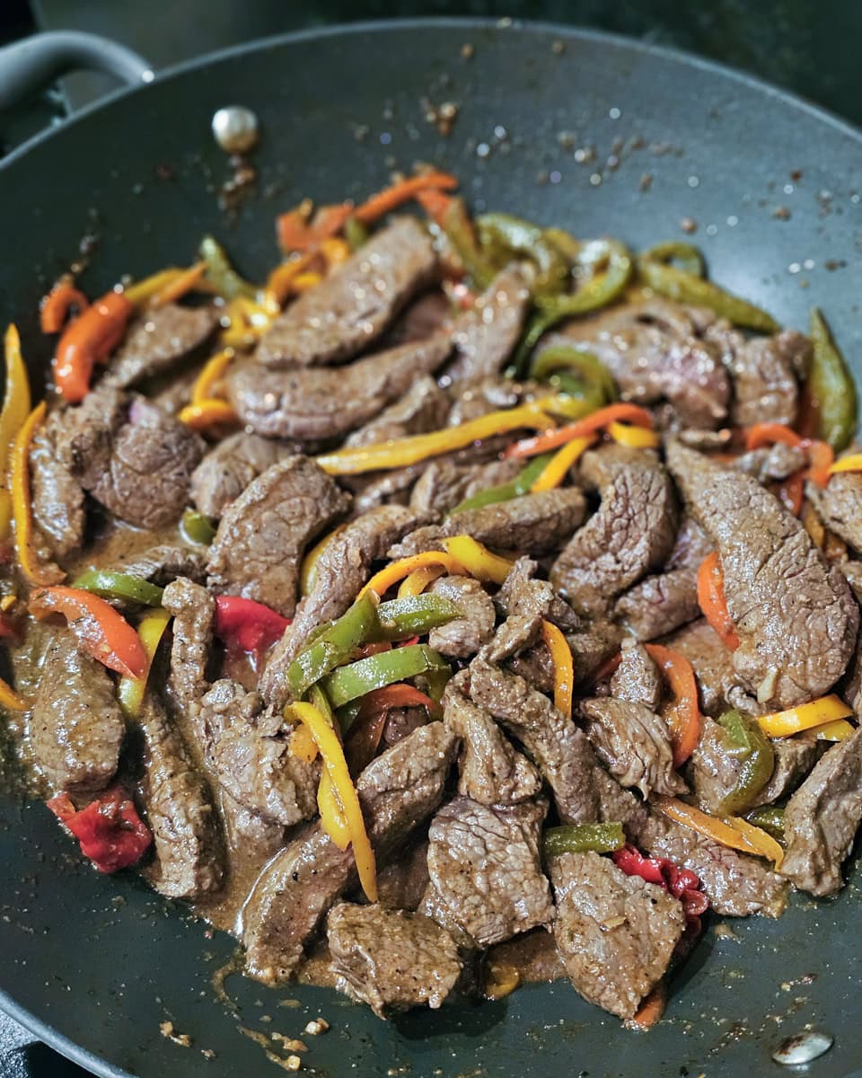 Cooking Jamaican pepper beef at home.