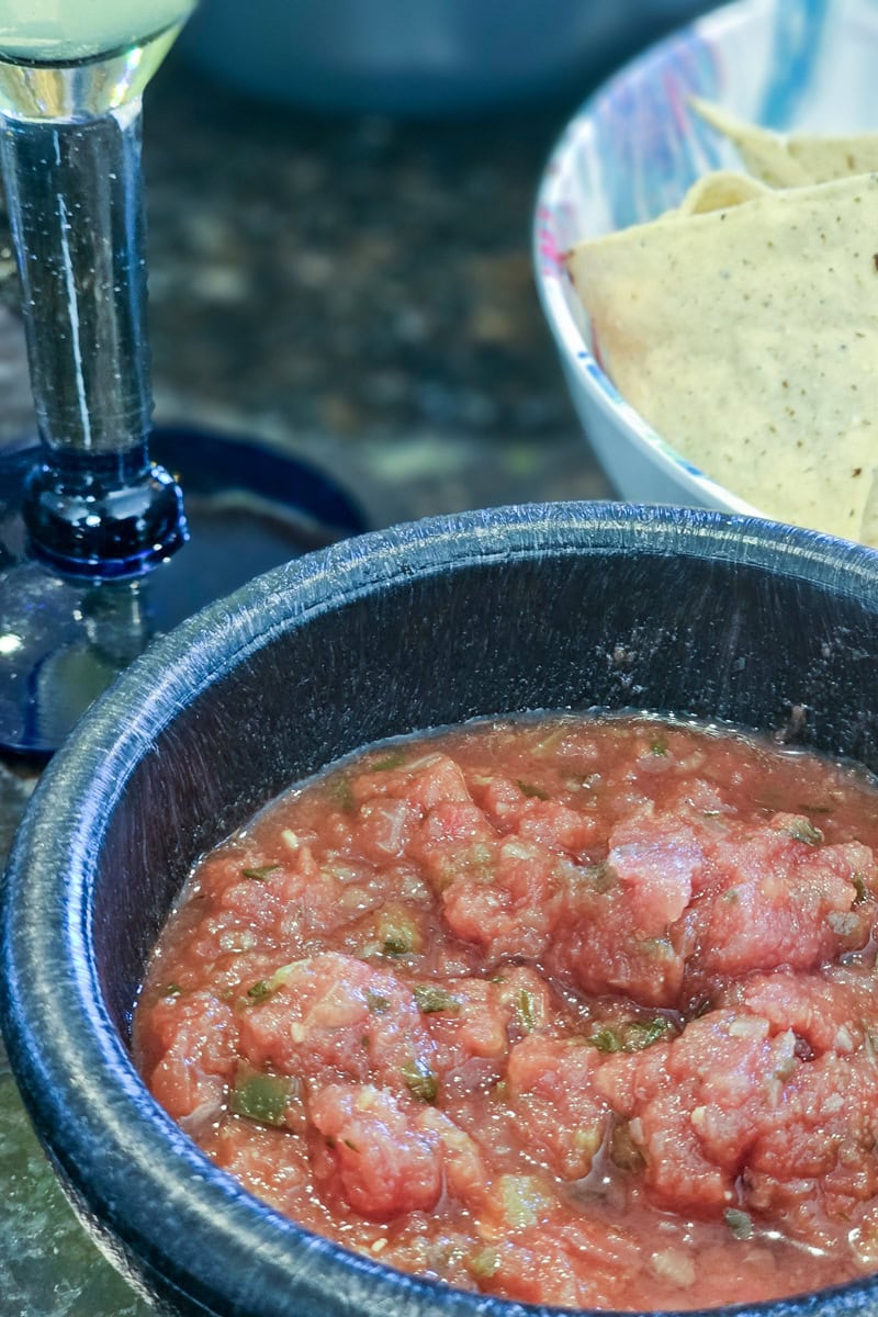 Homemade smoked salsa served with tortilla chips.
