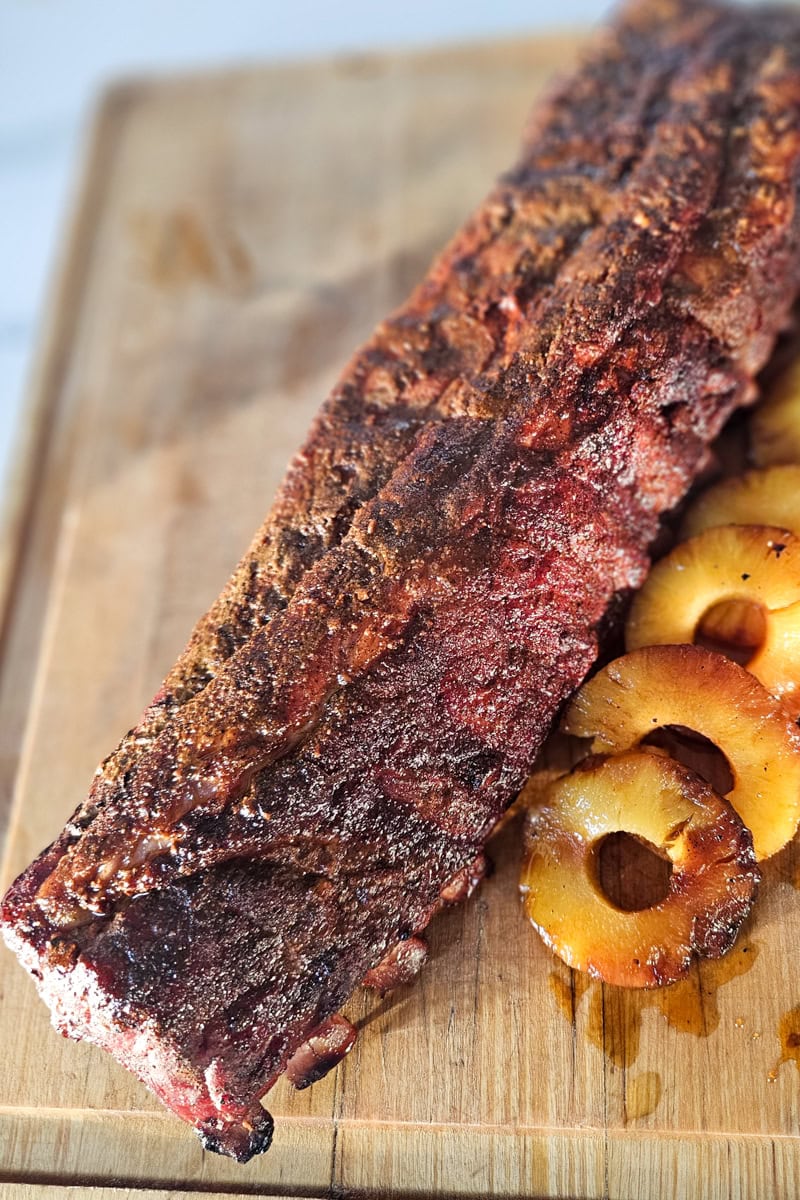 Smoked al pastor style ribs with pineapple slices.