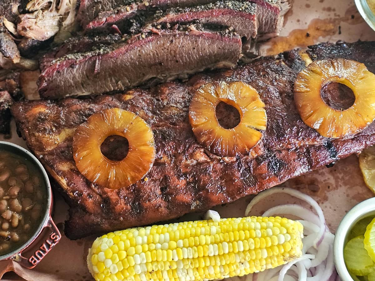 BBQ platter with ribs, brisket, pulled pork and BBQ sides.