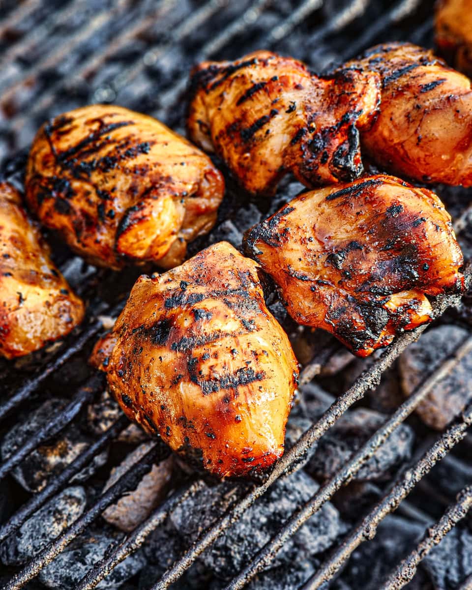 Cooking Huli Huli chicken thighs on a BBQ grill.