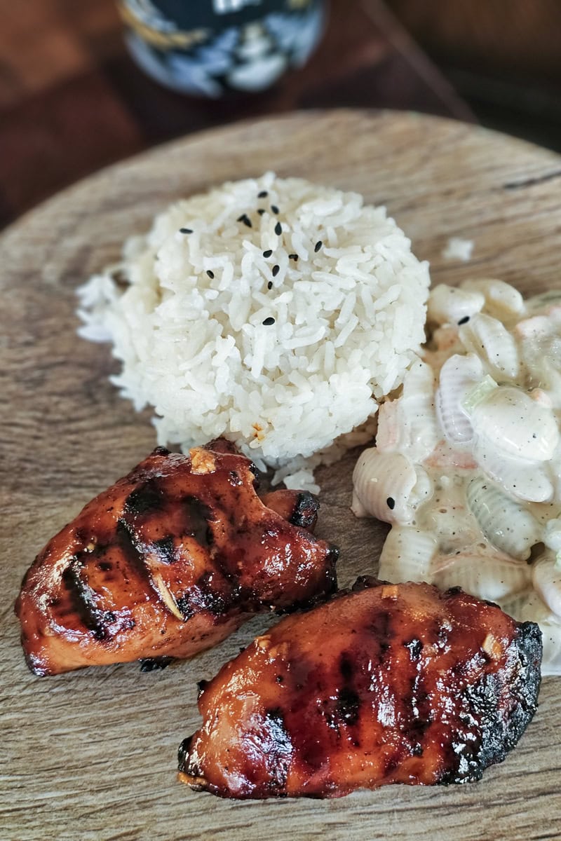 Hawaiian plate lunch with grilled Huli Huli chicken thighs, rice and macaroni salad.
