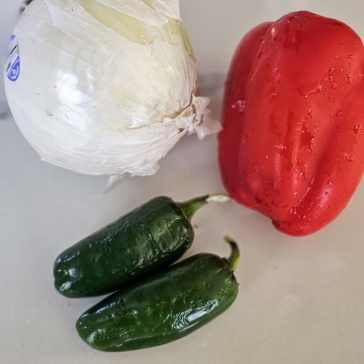 White onion, jalapenos, and a red bell pepper.