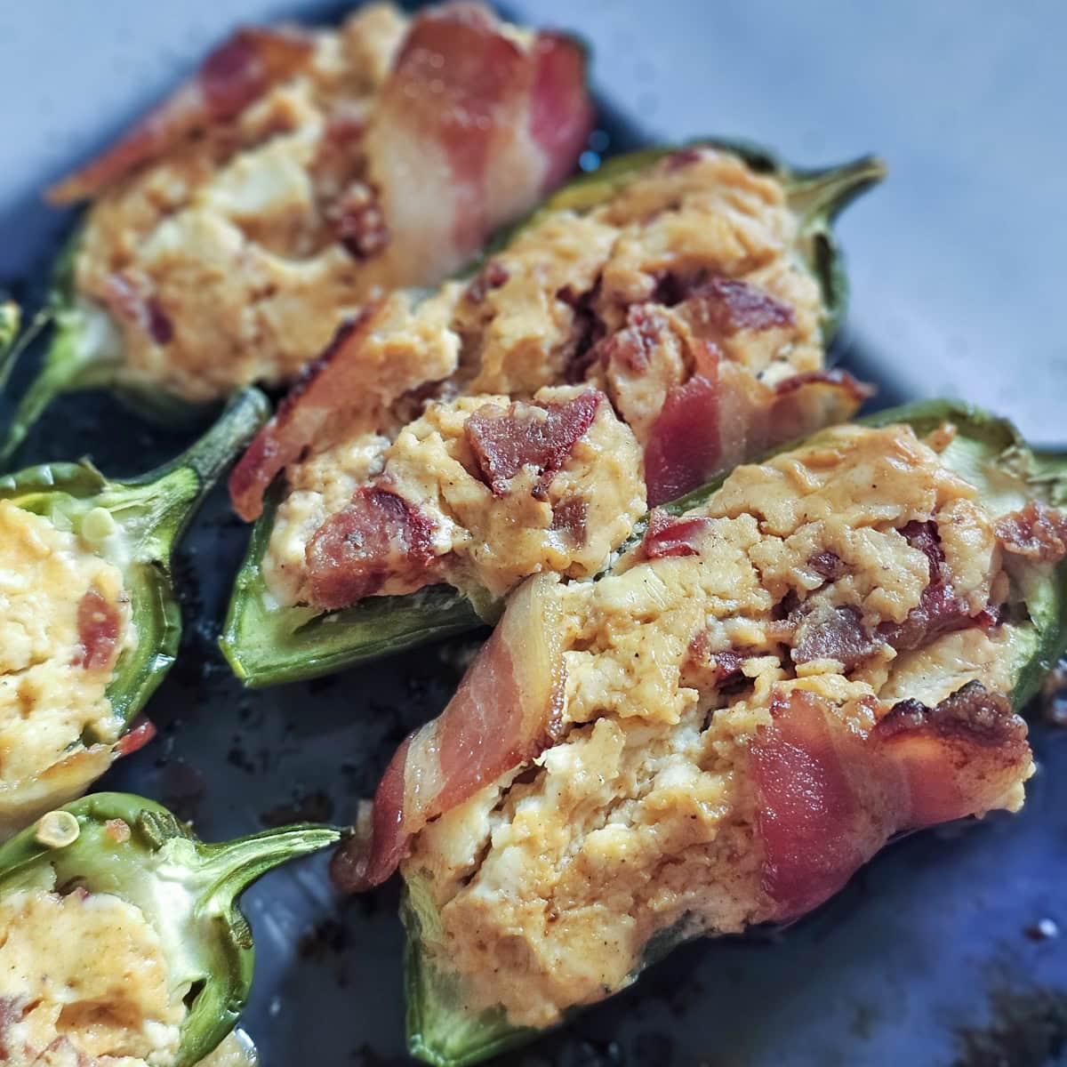 Bacon wrapped, hot link stuffed jalapeno poppers.