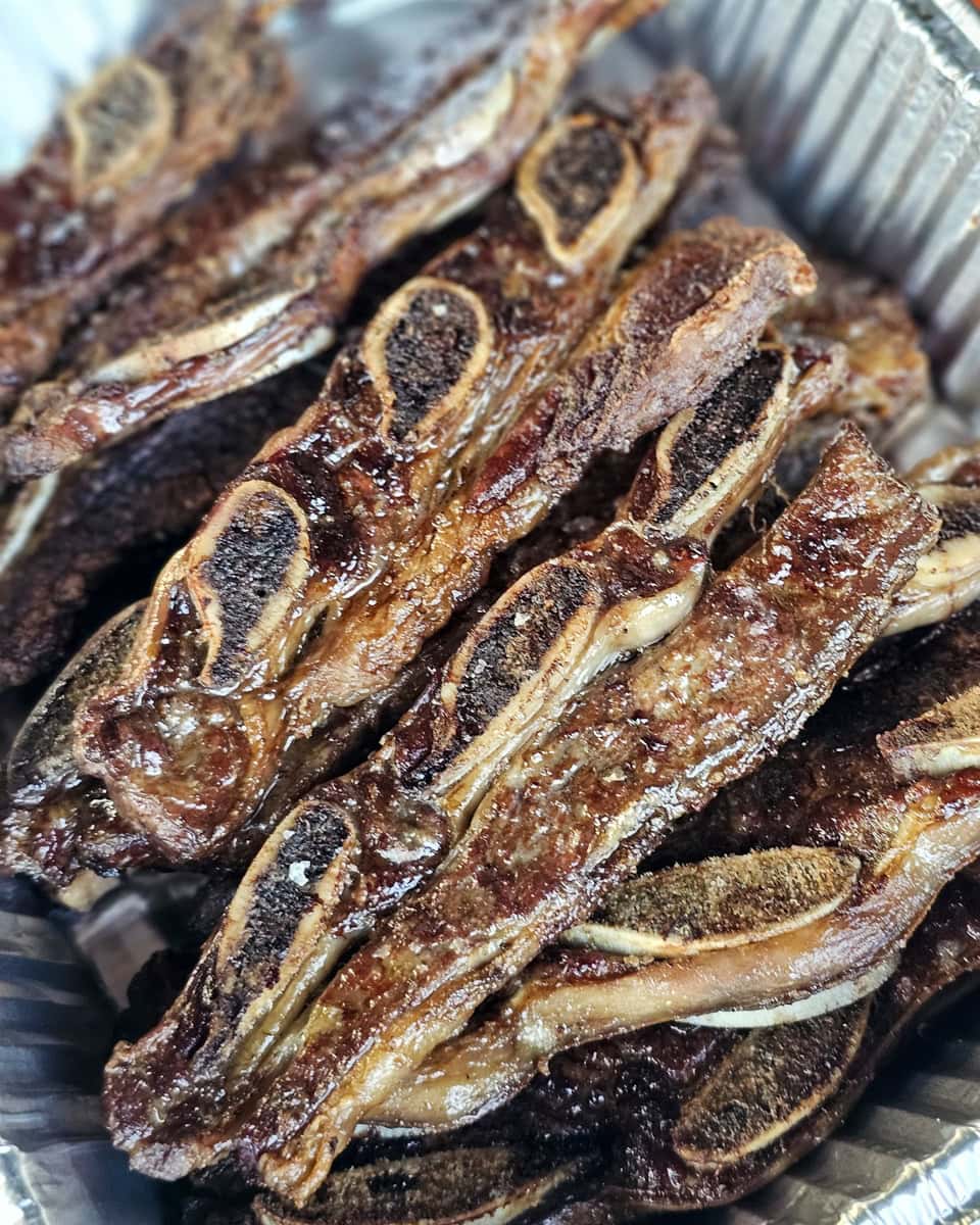 Tray of grilled Argentinian style beef ribs.