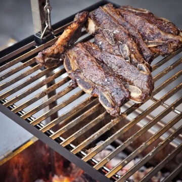 Cooking Argentinian style beef ribs on a Santa Maria grill.
