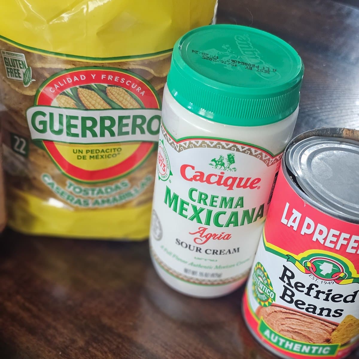 Tostada shells, Mexican sour cream, and refried beans.