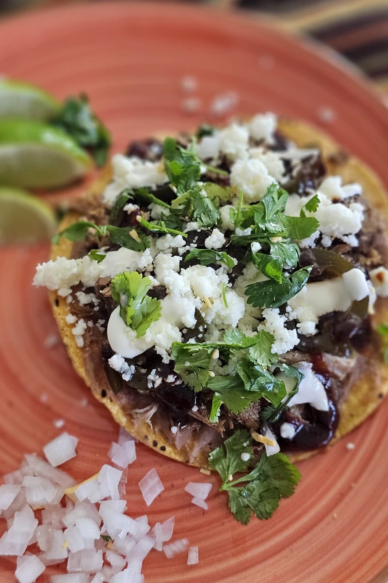 BBQ pork tostadas on a plate.