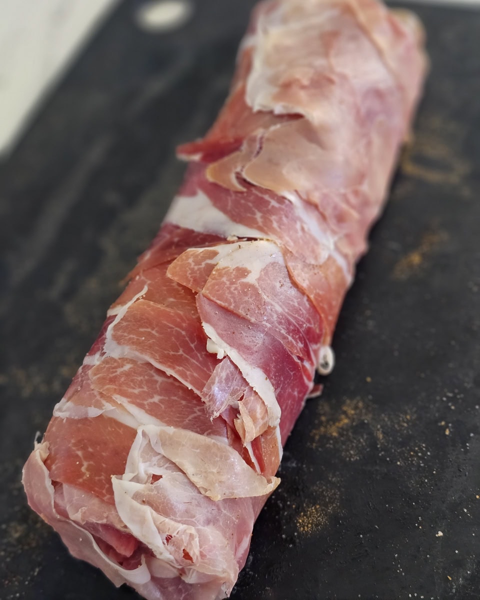 Stuffed pork loin wrapped in prosciutto.