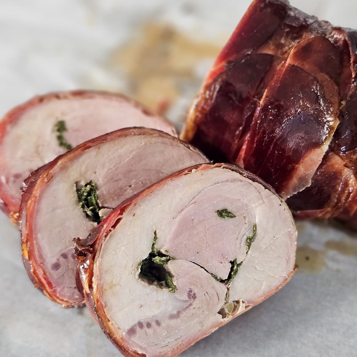 Smoked pork loin stuffed with sage butter and wrapped in prosciutto.