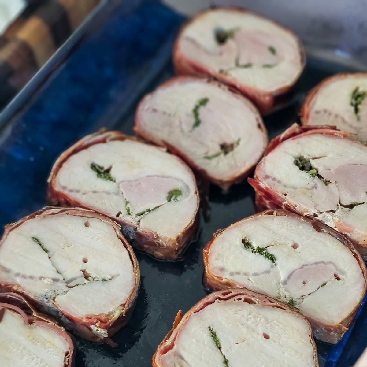 Slices of pork loin wrapped in prosciutto and stuffed with sage butter.