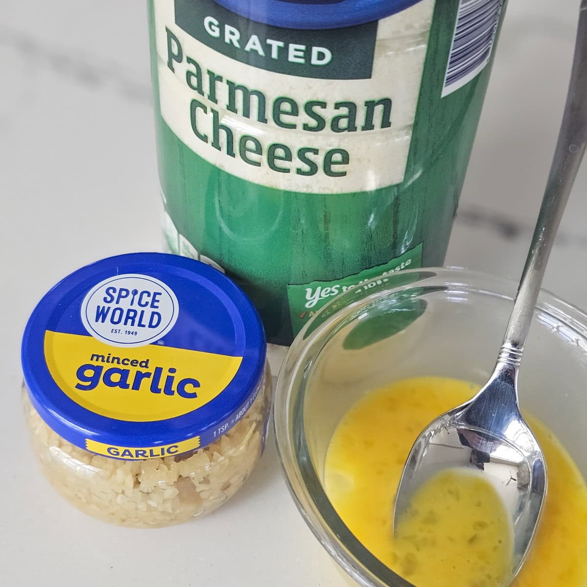 Parmesan cheese, a beaten egg, and minced garlic.