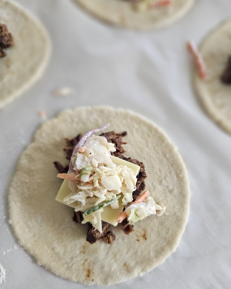 Slaw mix added to the filling of BBQ kolaches.